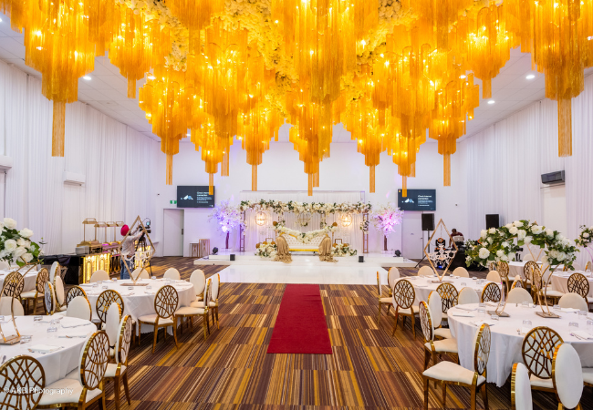 3Occasio-650px by450px luxury Indian wedding Melbourne 2026 — Occasio by Singh Events grand ballroom dressed for Indian wedding reception with mandap and floral decor